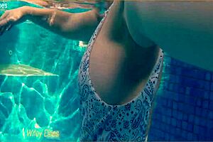 preview - wife swimming in the hotel pool in a hot one piece