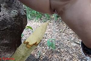 hey check it, this perverted slut is squirting piss from a wooden stake deep in the forest outdoors 😈🌳💦