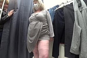 a plump milf with juicy ass in white panties and big tits in bra caught on hidden camera in public dressing room