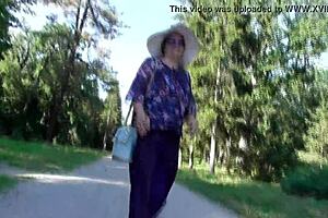 Hairy mature flashes in Aladdin pants at public park