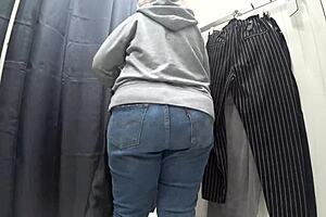 a plump milf with juicy ass in white panties and big tits in bra caught on hidden camera in public dressing room