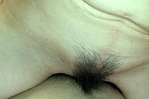 Japan mom granny Nobuko Tachikawa shows off pink pussy with hairy creampie lips in stockings and anal finger play on bed