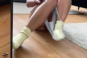 woman masturbates in mirror wearing sexy panties and socks