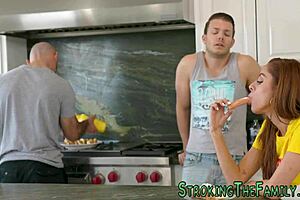 Latin teen 18+ blows stepbrother's dick while mature milf watches curiously from afar, blending old and young desires.