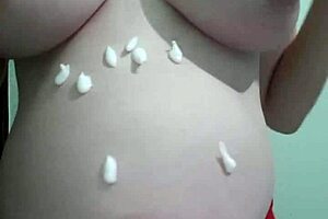 why is this pregnant milf getting cream and massage on her natural tits