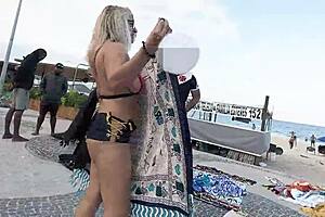 Walking in mini short along Copacabana beach drawing looks from men