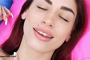 red haired model strips down on sofa during casting interview showing petite body