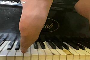 White angel Monika Fox poses naked at piano