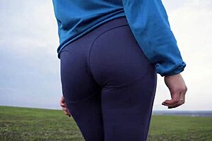 Milf with Nice Ass Teasing in Tight Yoga Pants and Thong from Behind