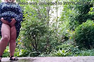 My mature mother-in-law pees standing up outdoors with her huge tits and big ass exposed! 😲💦