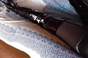 Petite brunette milf in sexy total black outfit with fishnets pantyhose and over-the-knee boots