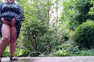 My mature mother-in-law pees standing up outdoors with her huge tits and big ass exposed! 😲💦