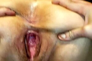 Milf shows her gaping pussy filled with fresh cum. Isn't that intriguing?