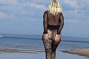 black style milf flashes big tits on the beach