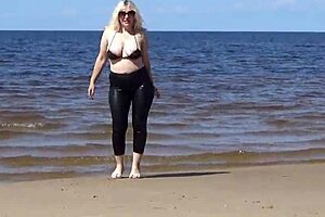 big leather ass blonde milf walks on beach in heels showing natural tits and pussy