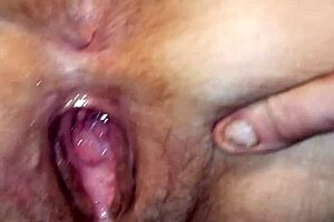 Milf shows her gaping pussy filled with fresh cum. Isn't that intriguing?