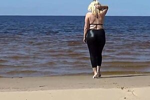 big leather ass blonde milf walks on beach in heels showing natural tits and pussy