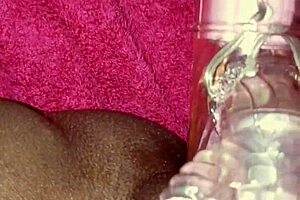 Woman explores her body with toys in a Caribbean setting