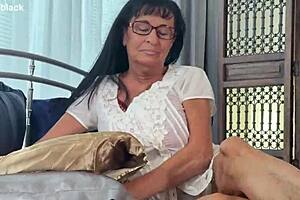 Bbw Big Tit Granny Indulges in Solo Masturbation with Fisting and Dildo in Bedroom. Her Huge Natural Tits and Wet Pussy Shine During Oily Striptease Session.