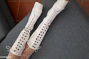 perfect-assed milf struts in high-heeled boots and fishnet stockings, showing off her curves