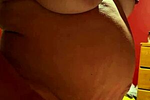 Pregnant MILF unleashes creamy wetness in intense solo session with squirting orgasm