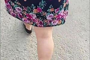 casual upskirt view of puta callejera in skirt on street