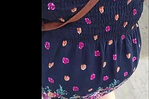 casual upskirt view of puta callejera in skirt on street