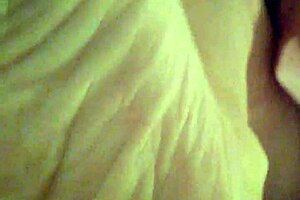 Tina slips into stockings for playful foot teasing and fetish fun in the bedroom