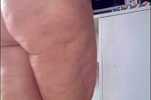 Stepmom tries on micro bikini for beach trip and asks stepson for opinion on videos.