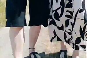 Hot granny's sunny walk