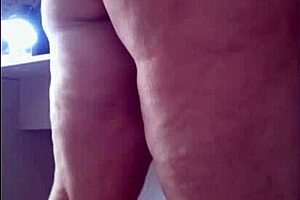 Stepmom tries on micro bikini for beach trip and asks stepson for opinion on videos.