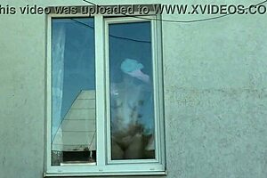 Nude neighbor mature milf without panties or bra washes windows while taxi driver watches from car 😏