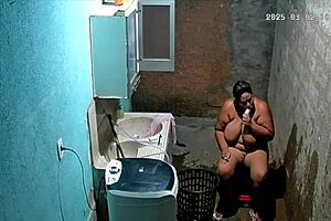 Hidden Camera Catches Busty Brazilian Neighbor Masturbating in Backyard While Voyeur Watches Intensely