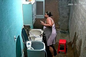 Hidden Camera Catches Busty Brazilian Neighbor Masturbating in Backyard While Voyeur Watches Intensely