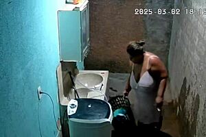Hidden Camera Catches Busty Brazilian Neighbor Masturbating in Backyard While Voyeur Watches Intensely