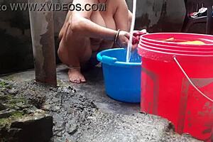 hey wife chilling with a bath right in the outdoor yard spot