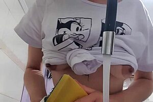 sexy latina maid washes dishes with huge tits bouncing out