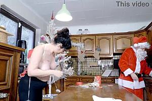 Emmita's huge natural tits bounce wildly during xmas kitchen ride ending in terry's deep anal creampie