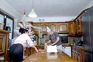 Emmita's huge natural tits bounce wildly during xmas kitchen ride ending in terry's deep anal creampie