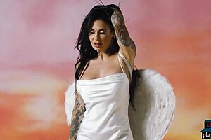 busty tattooed milf joanna angel strips luscious body for playboy